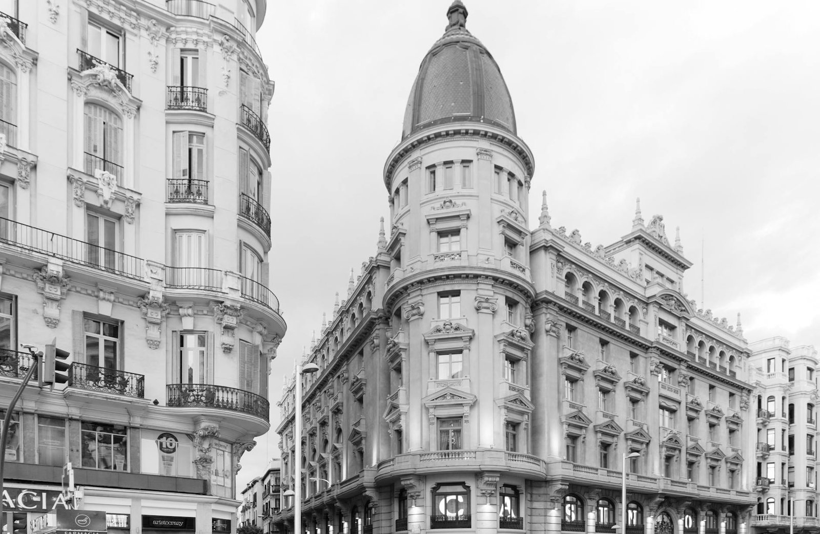 Black and white view of elegant historical buildings in Madrid, Spain.