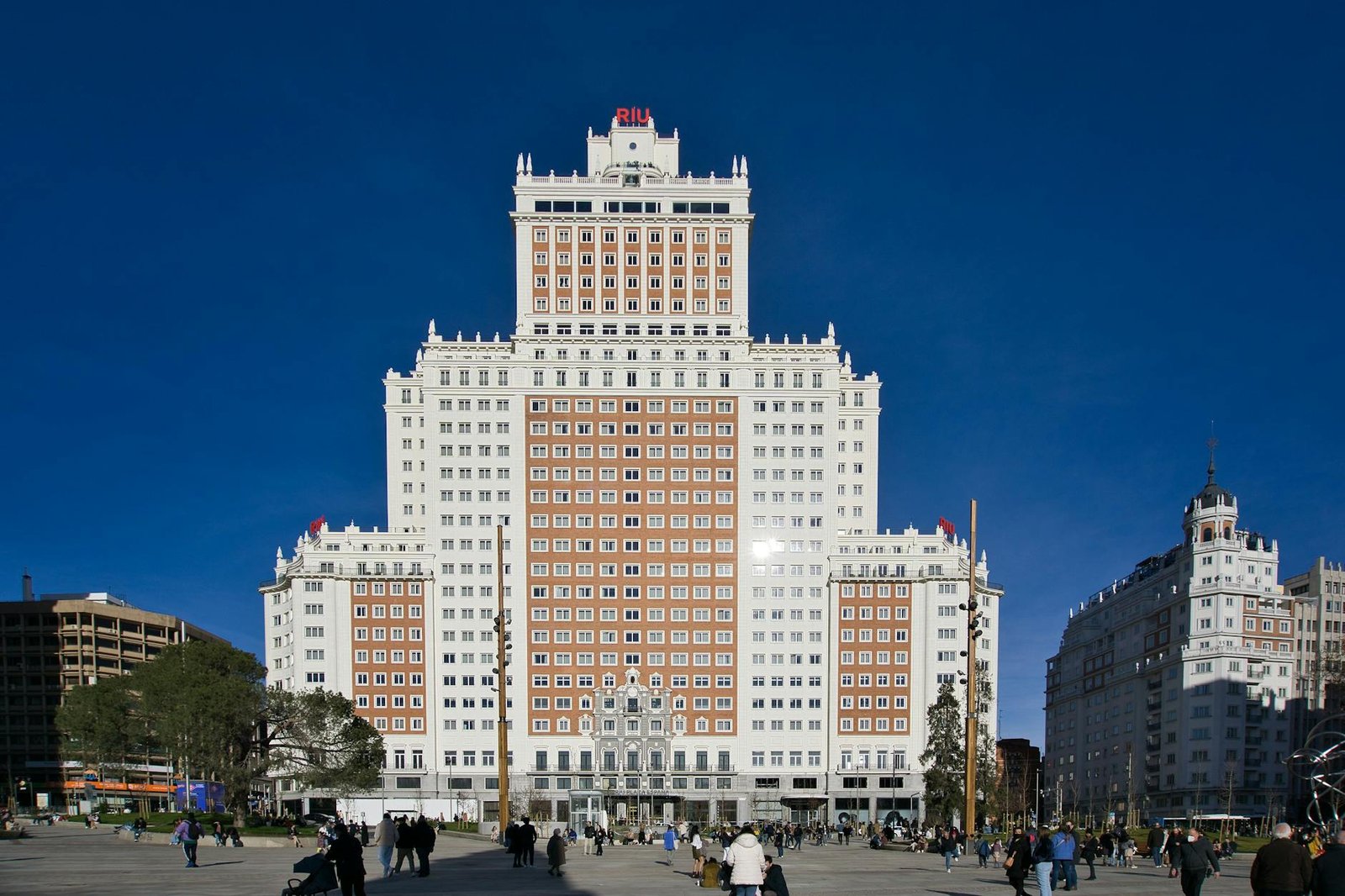 Stunning view of Hotel Riu Plaza Espana with vibrant city life in Madrid, Spain.