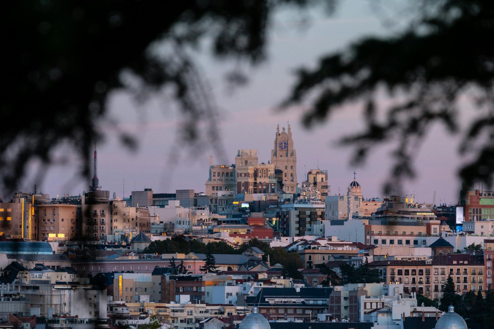 Beautiful cityscape of Madrid, Spain, captured during twilight with iconic landmarks visible.