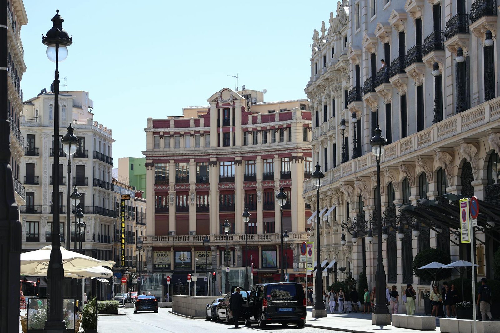 Beautiful European city street featuring classic architecture and bustling urban life.