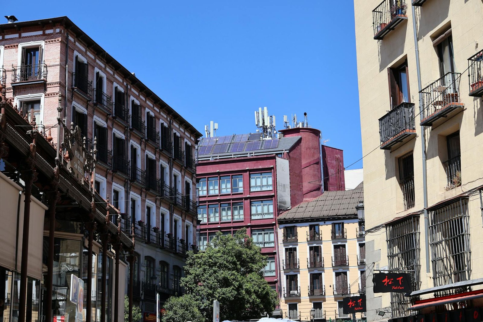 View of architectural buildings and urban details in a sunny cityscape.